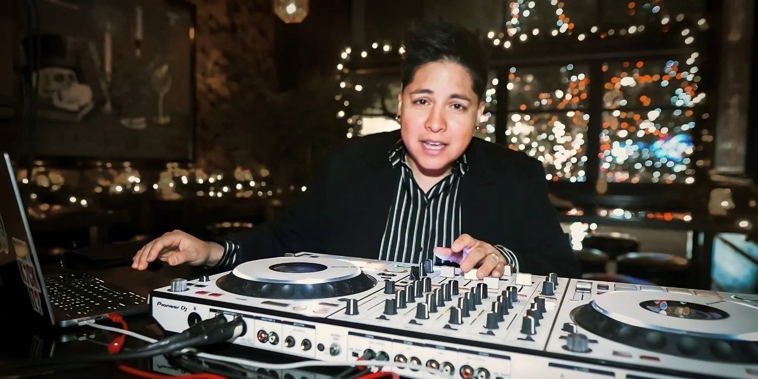 DJ KICKIT performing behind DJ equipment at an event in Austin, Texas