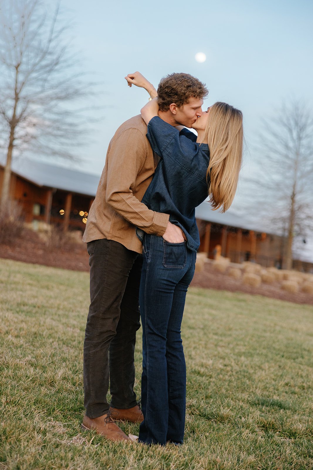 Engagement photo of woman and man kissing at Southall Farm and Inn
