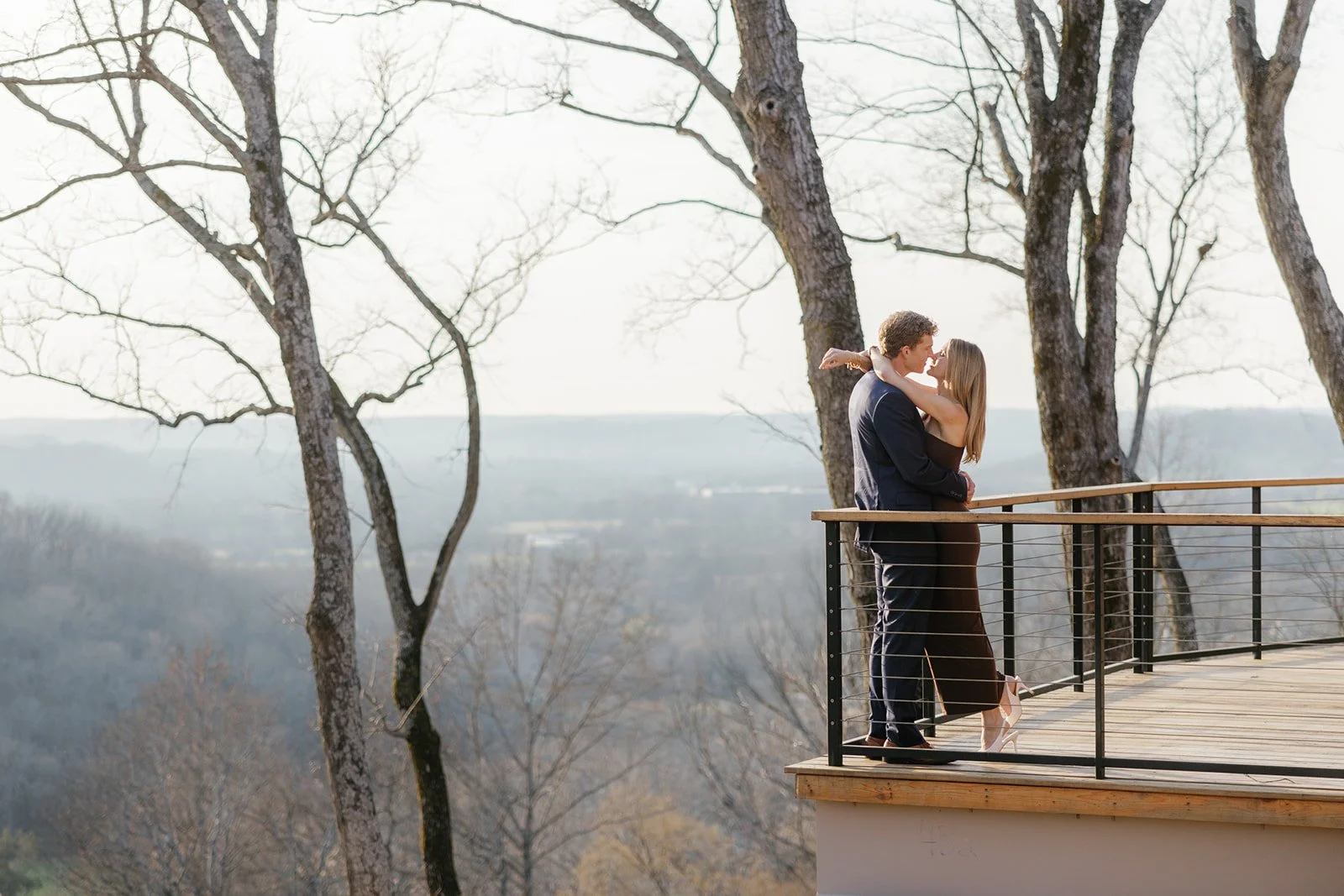 Engagement photos at Southall Farm and Inn with the couple on the balcony smiling