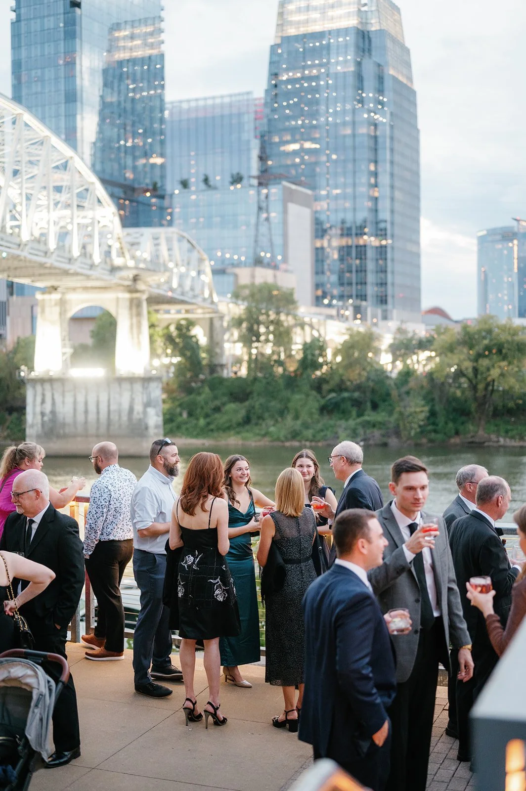 Guests enjoying themselves at a downtown Nashville outdoor wedding with a city view