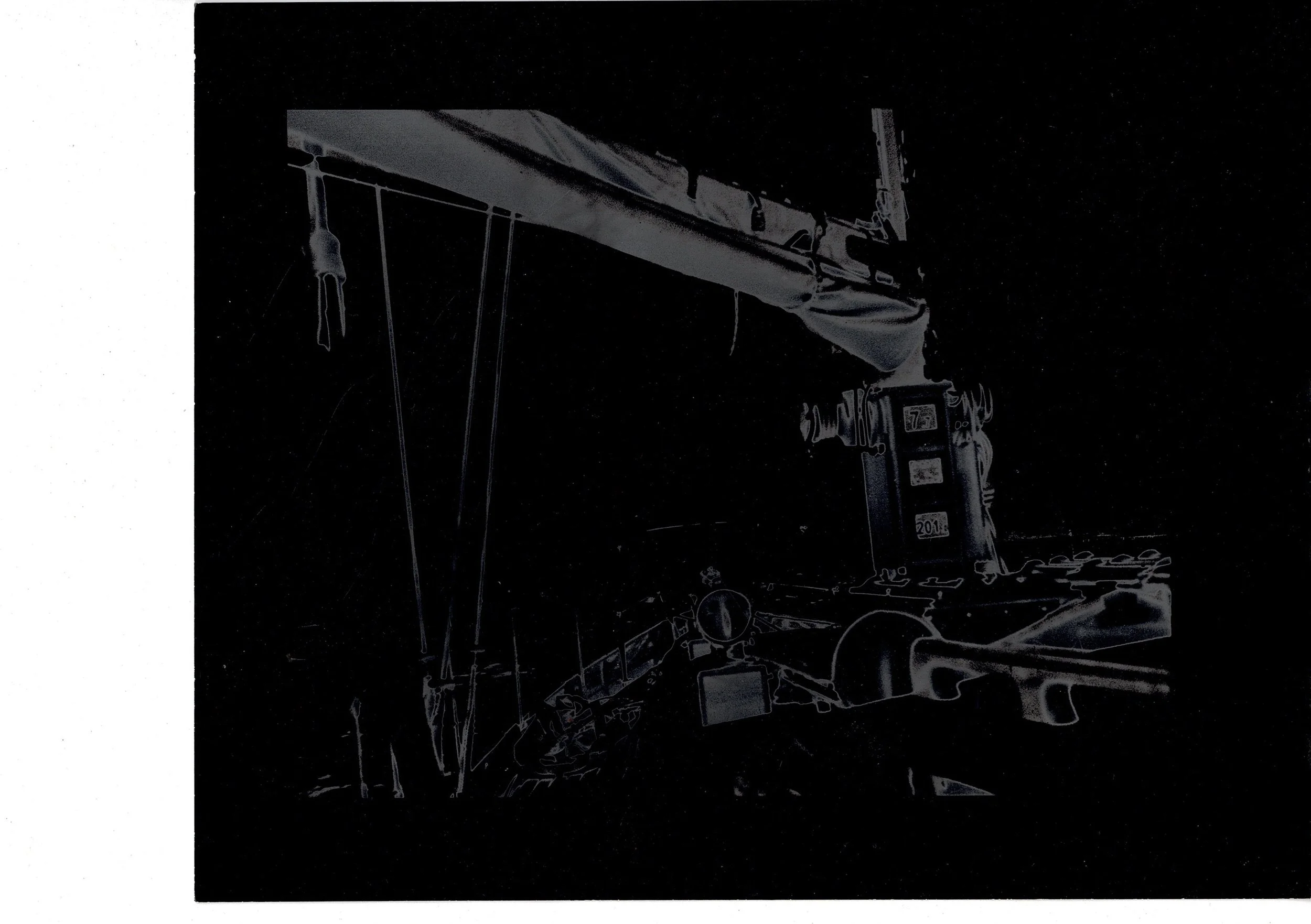 Solarised black and white silver gelatin print of the classic racing yacht Sardonyx sailing, ghostly reversed tones, hand-printed on Ilford paper