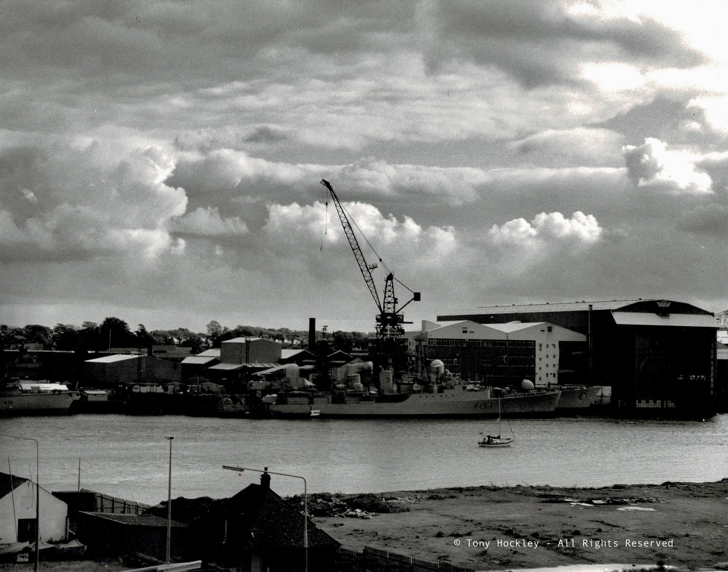 1984. Storm clouds over Vesper Thorneycroft shipyard, Woolston. Viewed across the River Itchen, Southampton (Printed 2024) 
