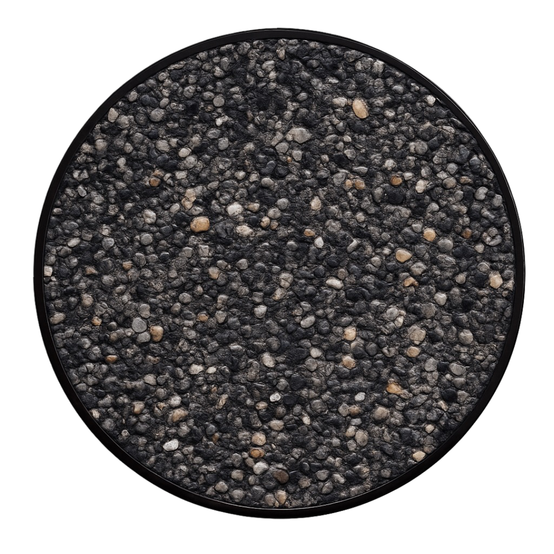 Close-up of a round container filled with black and gray small pebbles.