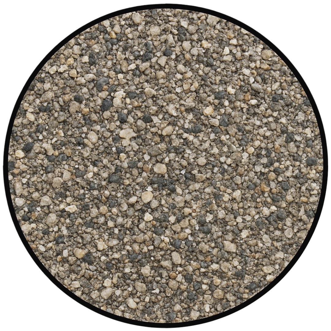 Close-up of gravel and small stones with various shades of gray, beige, and brown.