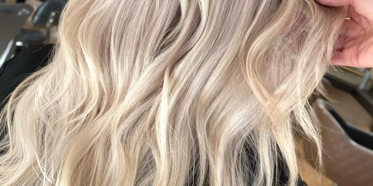 Close-up of wavy, blonde hair.