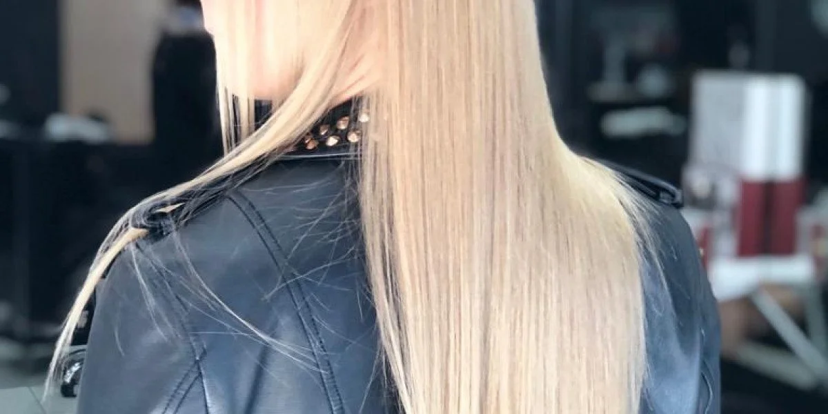 Close-up of wavy, blonde hair with highlights.