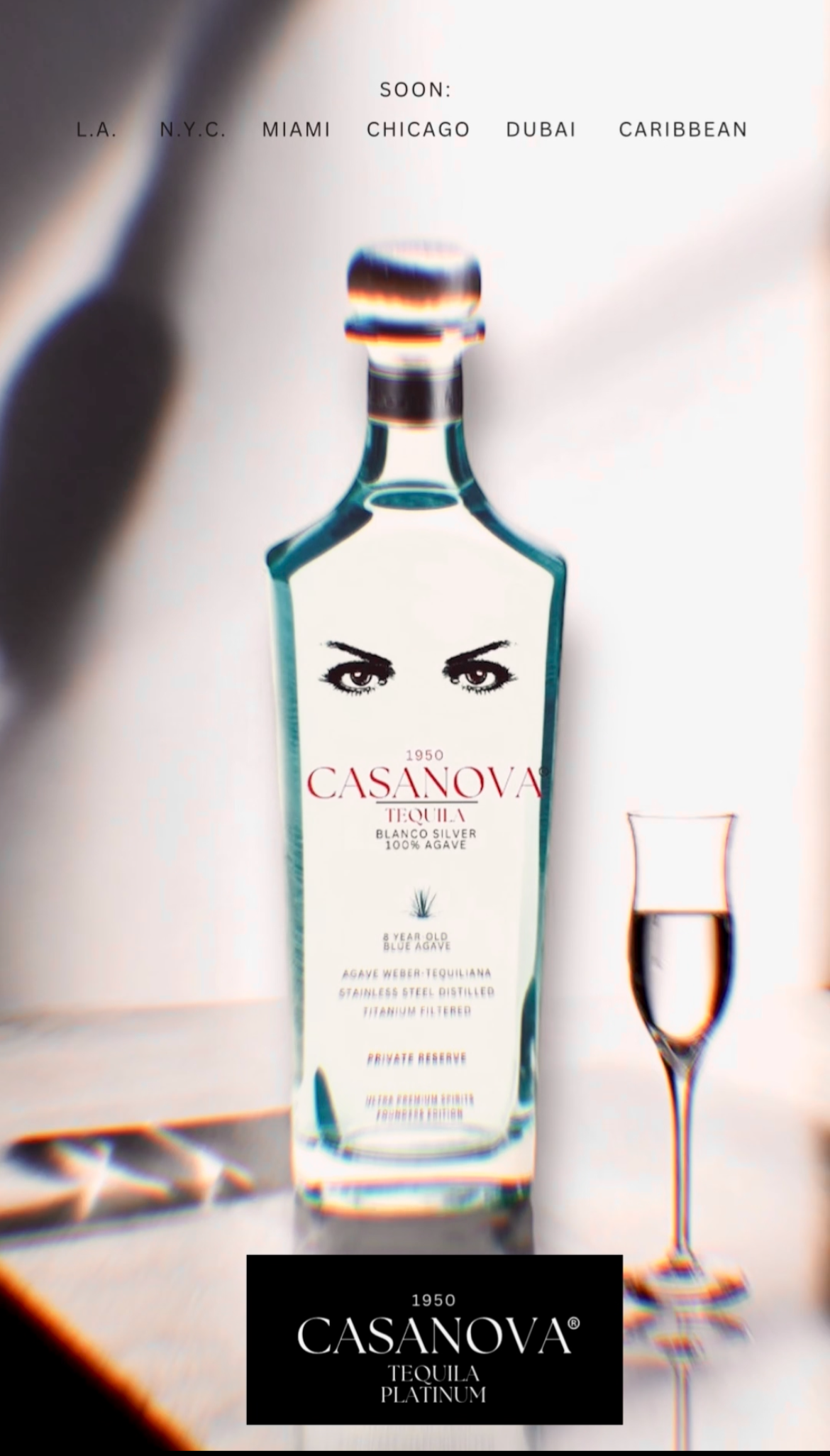 A bottle of Casanova tequila labeled '1950,' with a pair of eyes on the label, a shot glass filled with tequila, and a black box with white text reading '1950 Casanova Tequila Platinum,' against a white background.