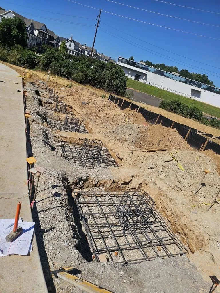 Image of a concrete foundation being poured