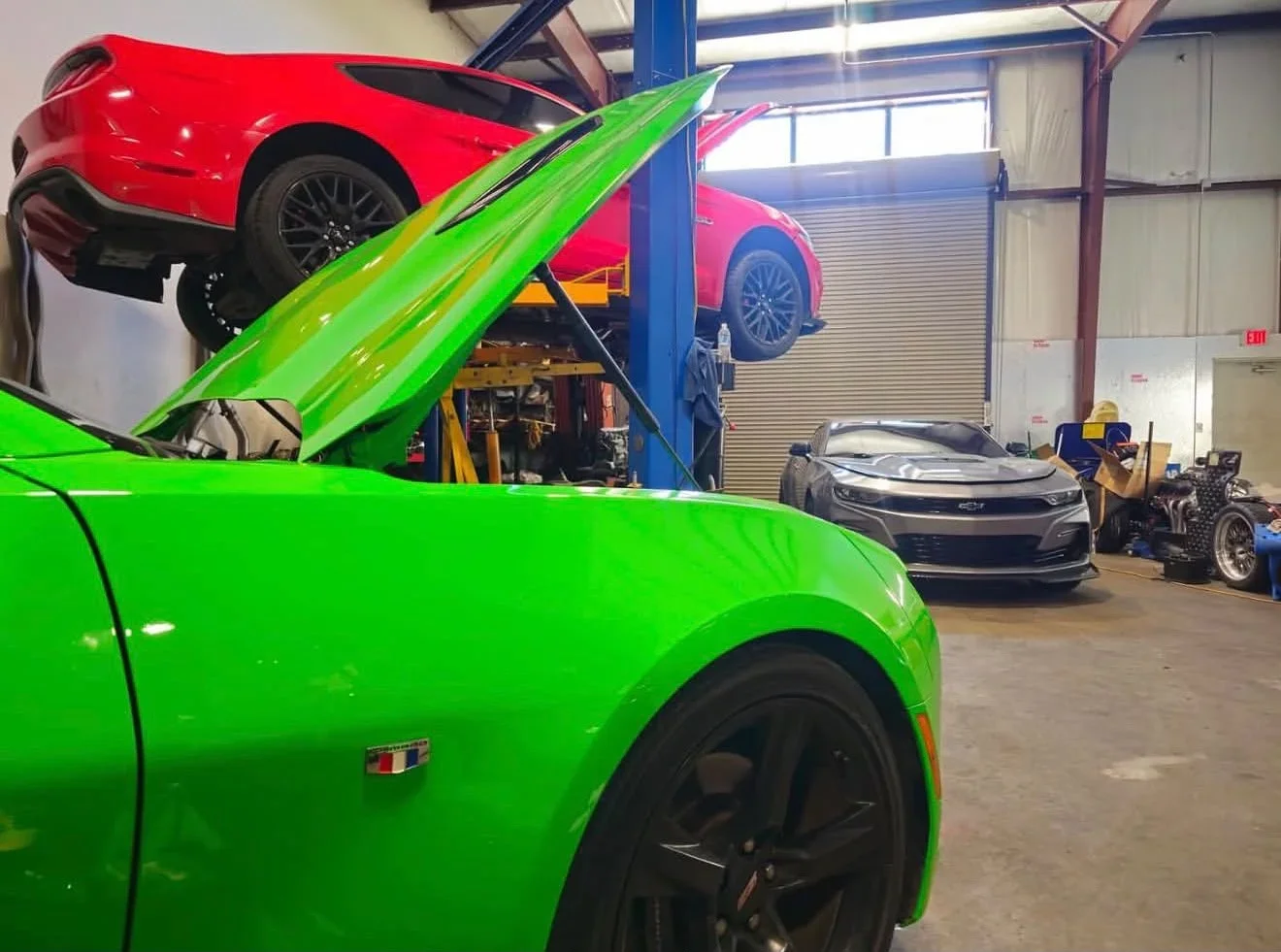 RAM Performance LLC auto repair shop in Walker LA with sports cars in service bay.