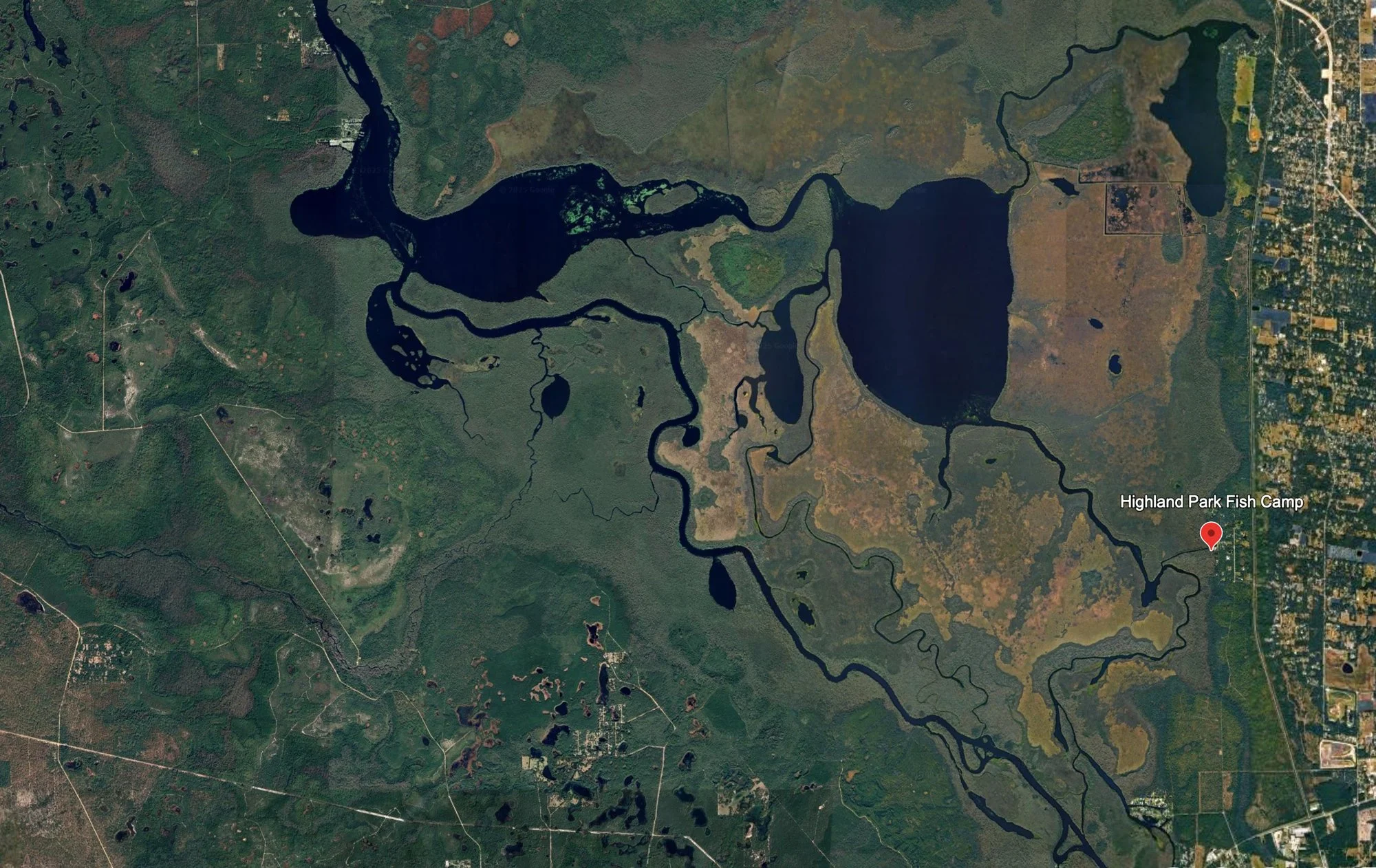 Satellite view of Lake Woodruff National Wildlife Refuge and Highland Park Fish Camp in DeLand, Florida.