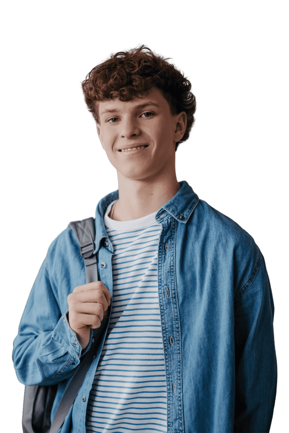 Young man with curly hair wearing denim jacket and striped shirt, carrying a backpack, smiling at the camera.