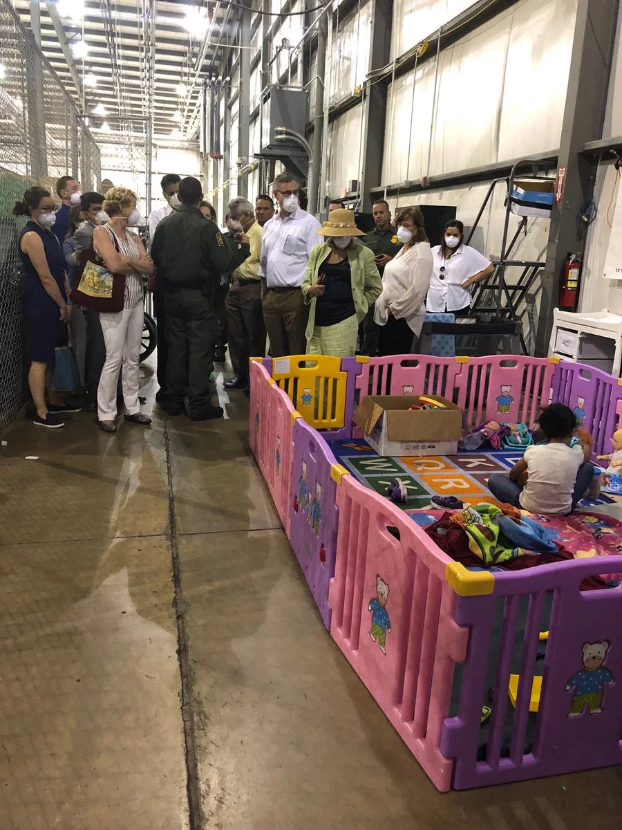 A colorful play area sits against the warehouse wall of the Ursula detention center. (Photo credit: Rep. Jackie Speier)