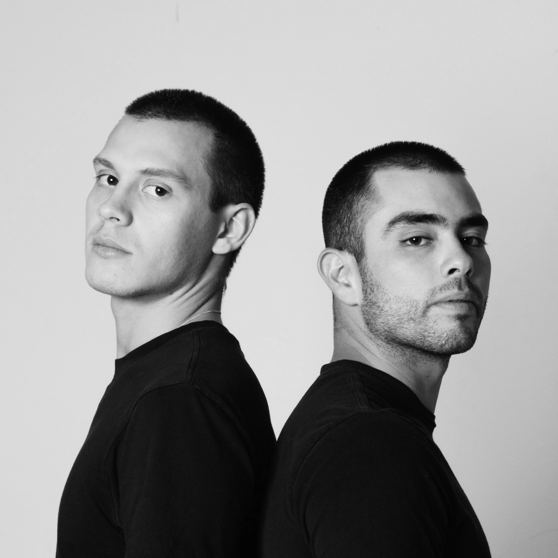 Portrait of the Tantrum Toddlers studio team on a grey background.