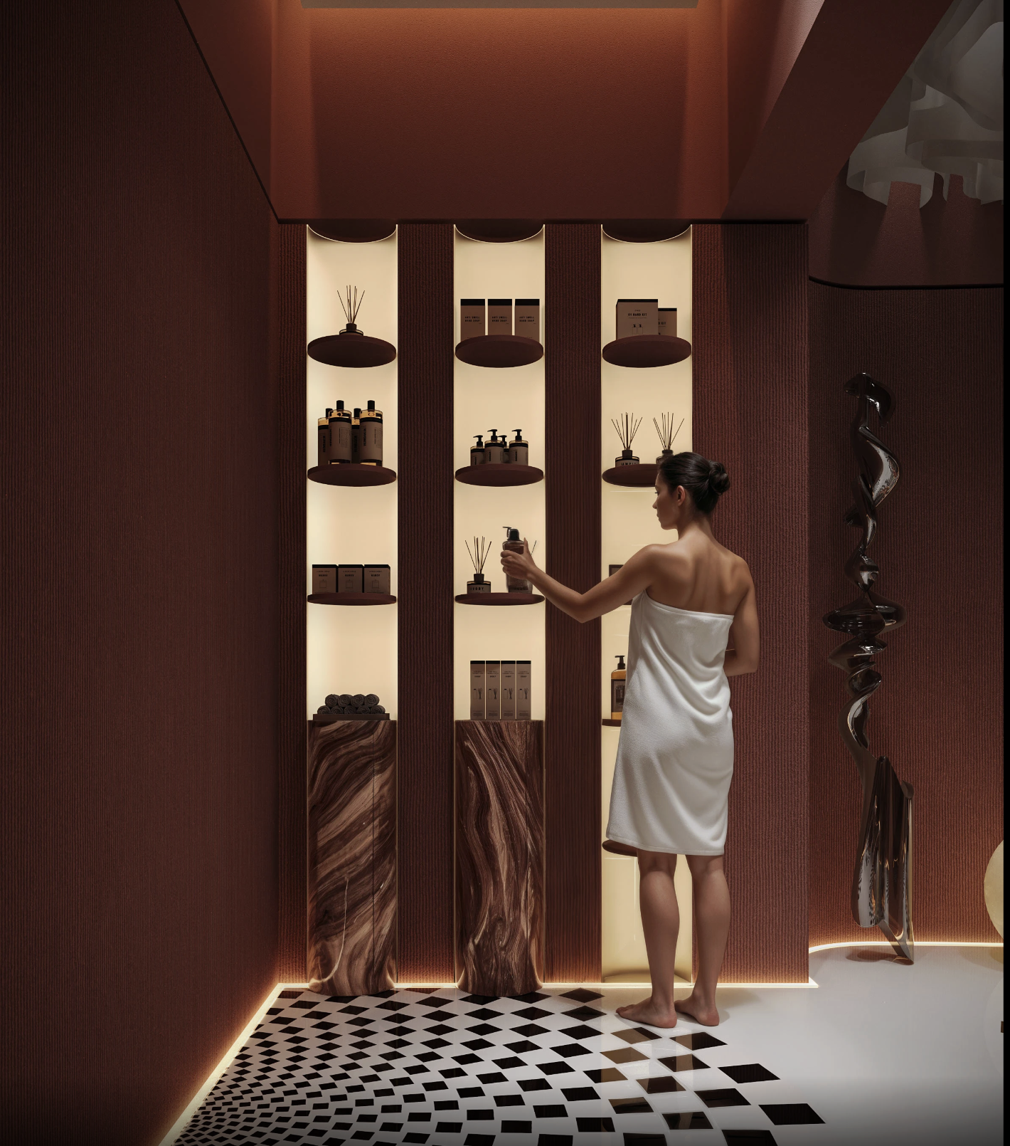 A woman wrapped in a white towel stands in a modern, stylish room, holding a container of lotion or cream. The room features warm red walls, illuminated shelving with toiletries, reed diffusers, and decorative items, along with a patterned black and white floor.