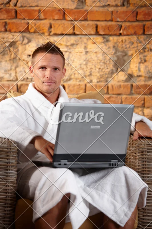 canva-handsome-man-in-bathrobe-with-computer-MABkbpQy1rU.jpg
