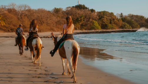women horseback riding on costa rica yoga retreat
