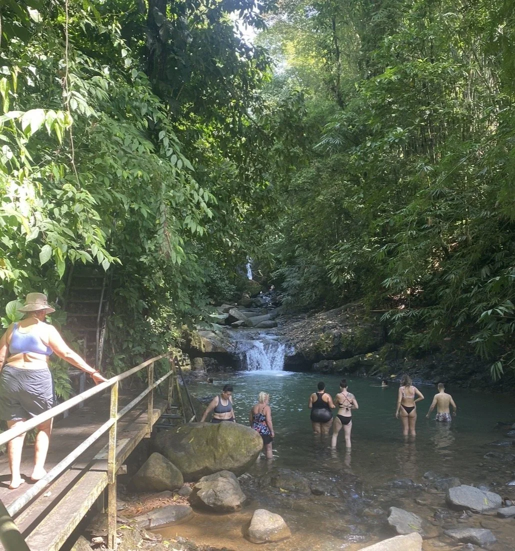 women in costa rica at waterfall 