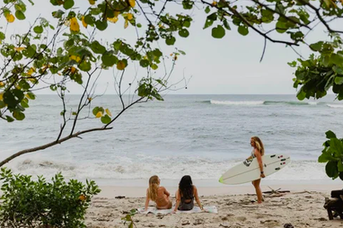 women on beach on a yoga retreat in costa rica