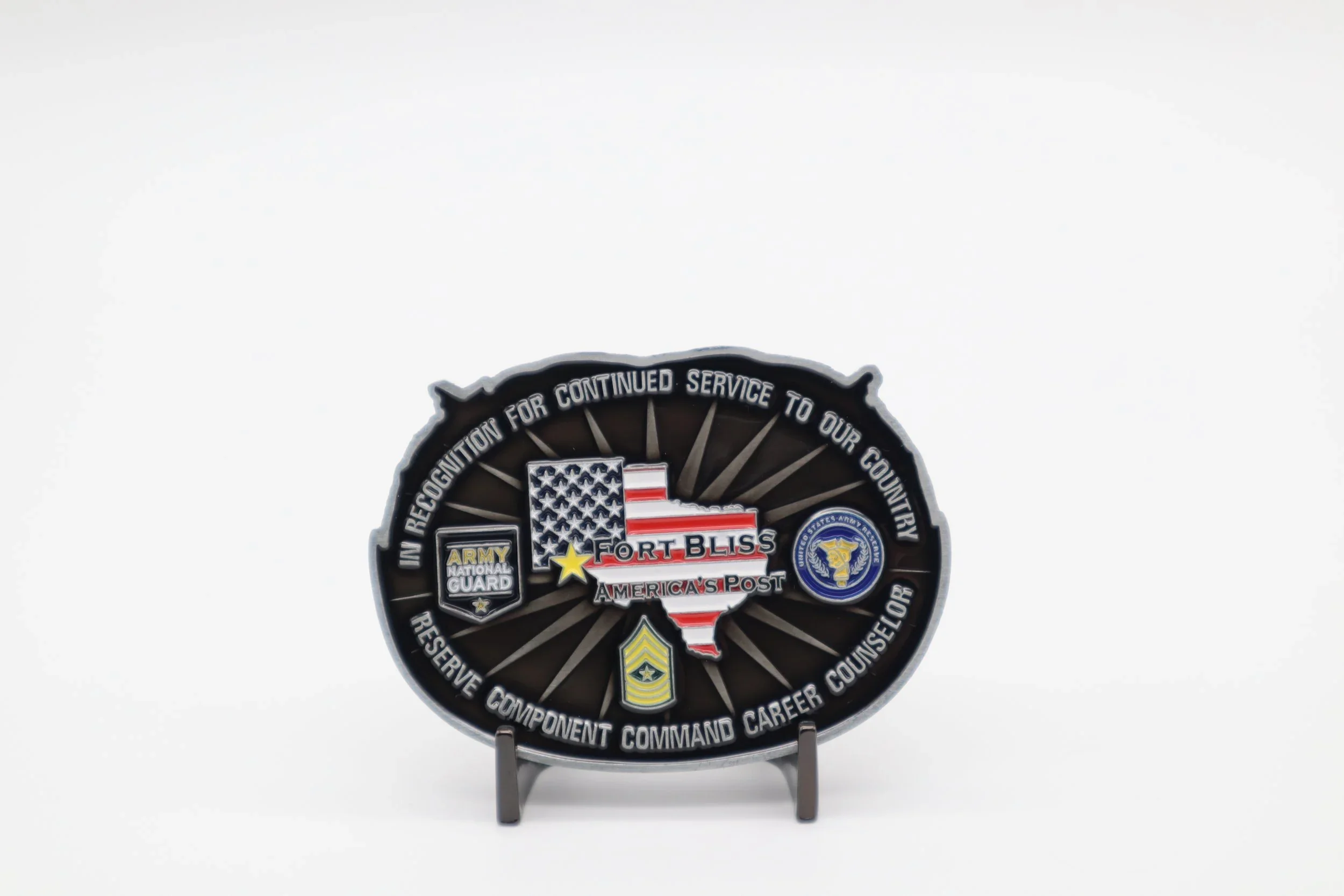 A patriotic badge featuring the shape of Texas with American flags and military insignias, including the Army National Guard and U.S. Army, and text emphasizing service, recognition, and America's patriotism.