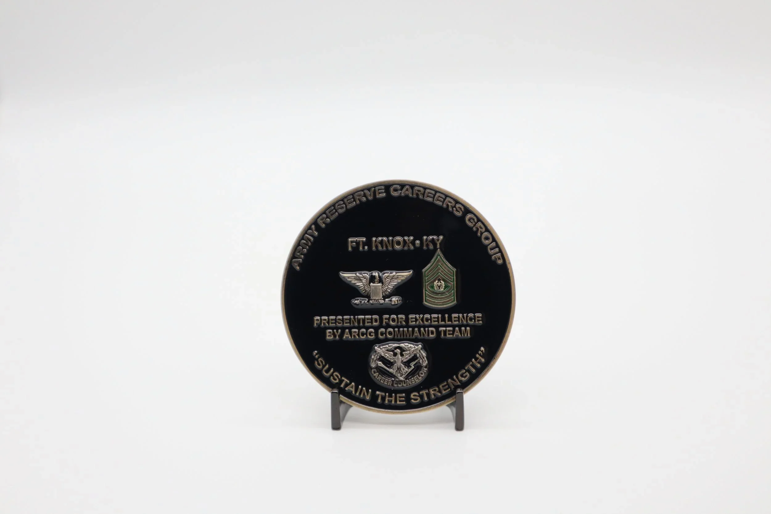 A circular award medal with military and professional insignia, inscribed with 'Army Reserve Careers Group,' 'Ft. Knox KY,' and phrases 'Presented for Excellence' and 'Sustain the Strength'.