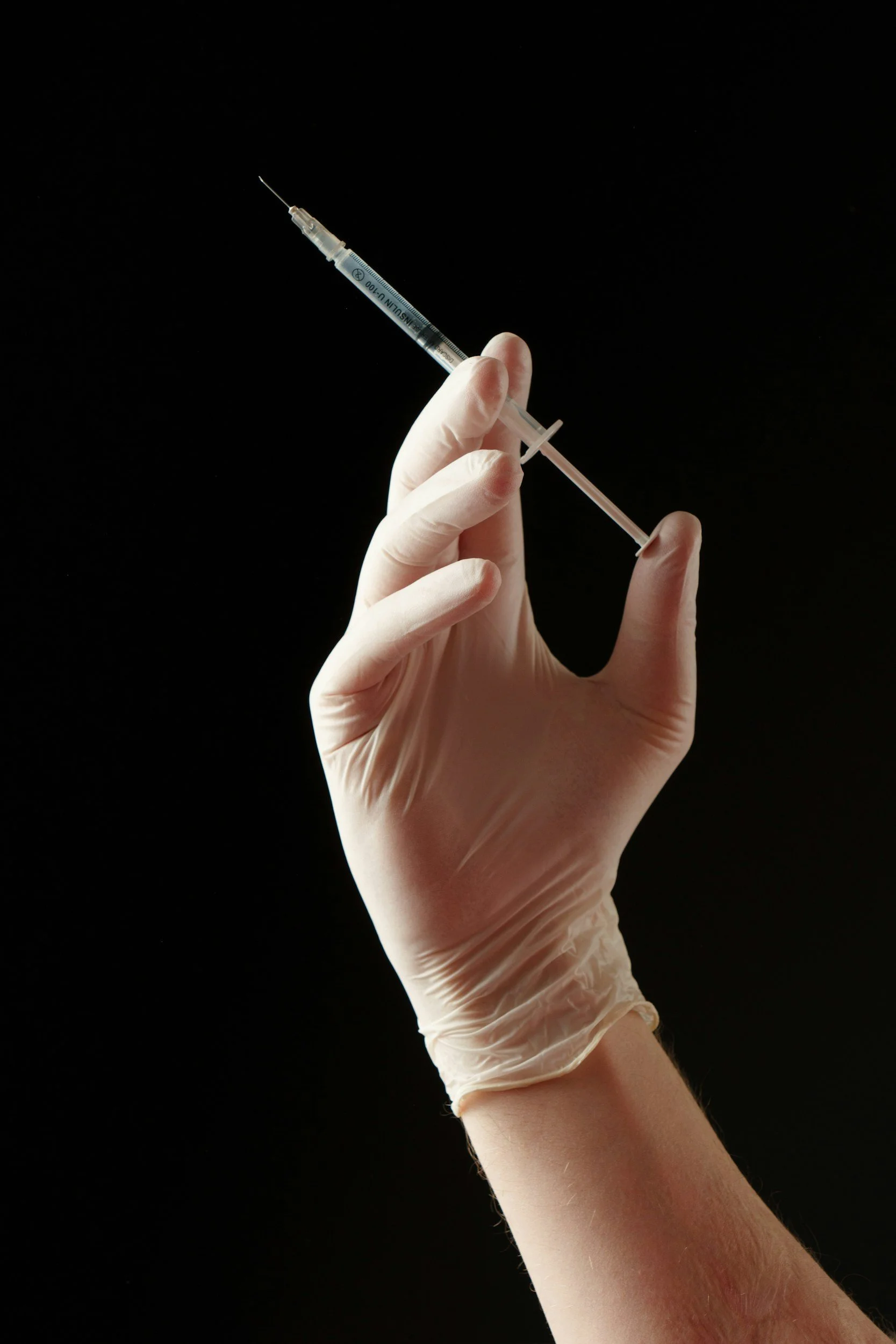 hand and syringe