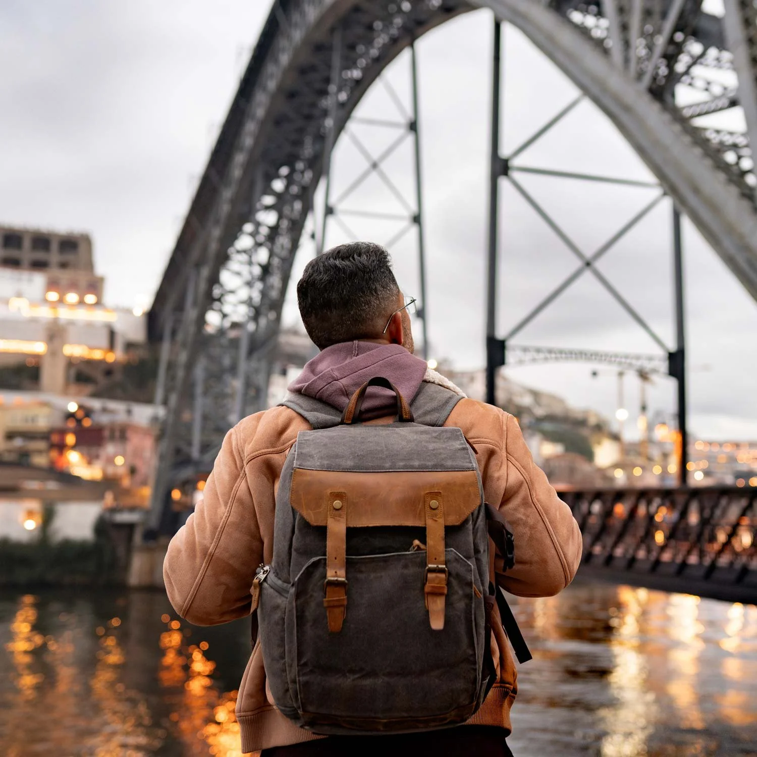 Man hikes around an urban city.