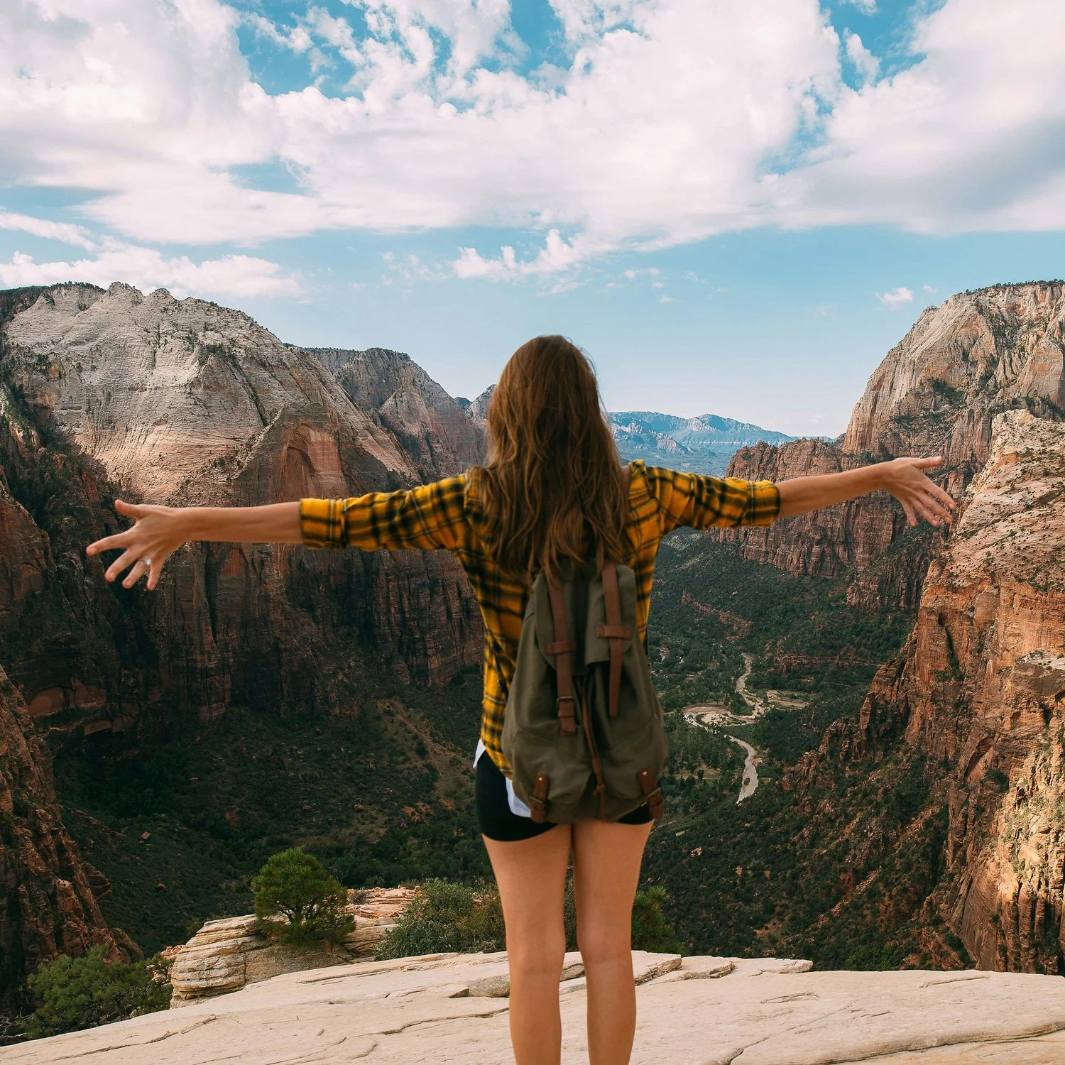 Woman hikes at Zion national park.