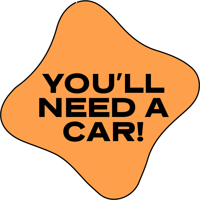 A speech bubble with a black outline and orange background that says "You'll Need a Car!" in bold black letters.