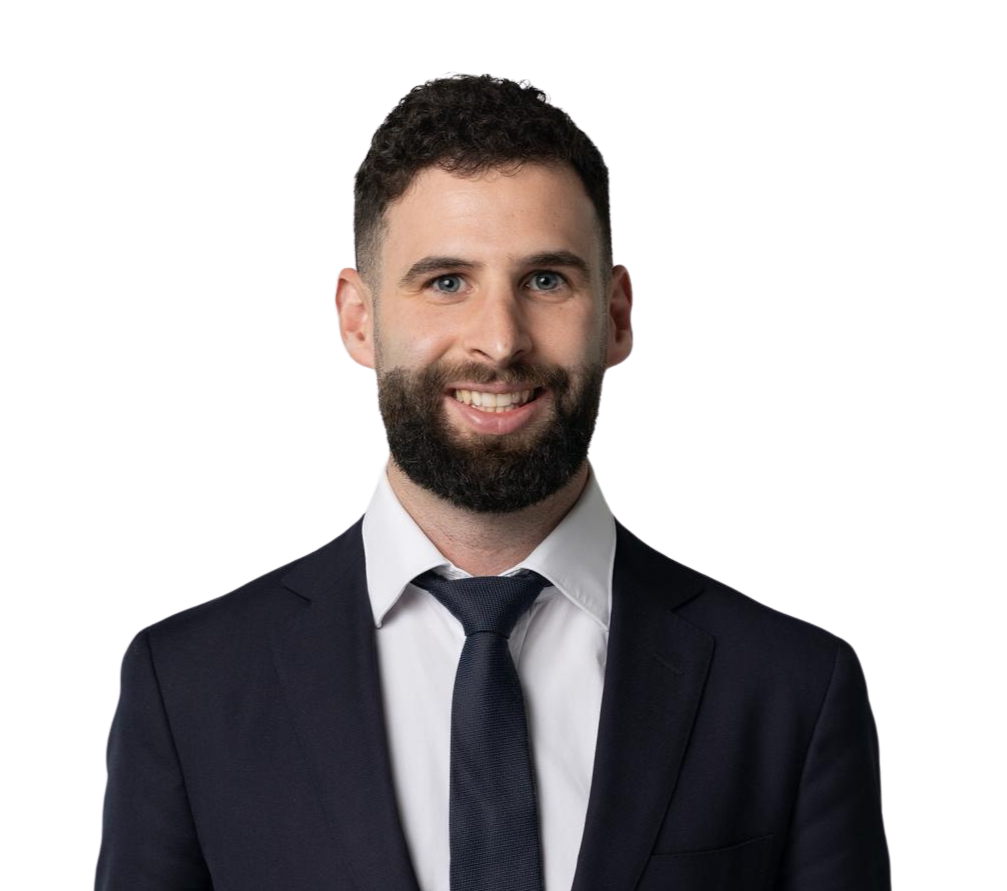 A smiling man with a beard and short dark hair, wearing a black t-shirt with a logo that says 'Foodfilix' on it.