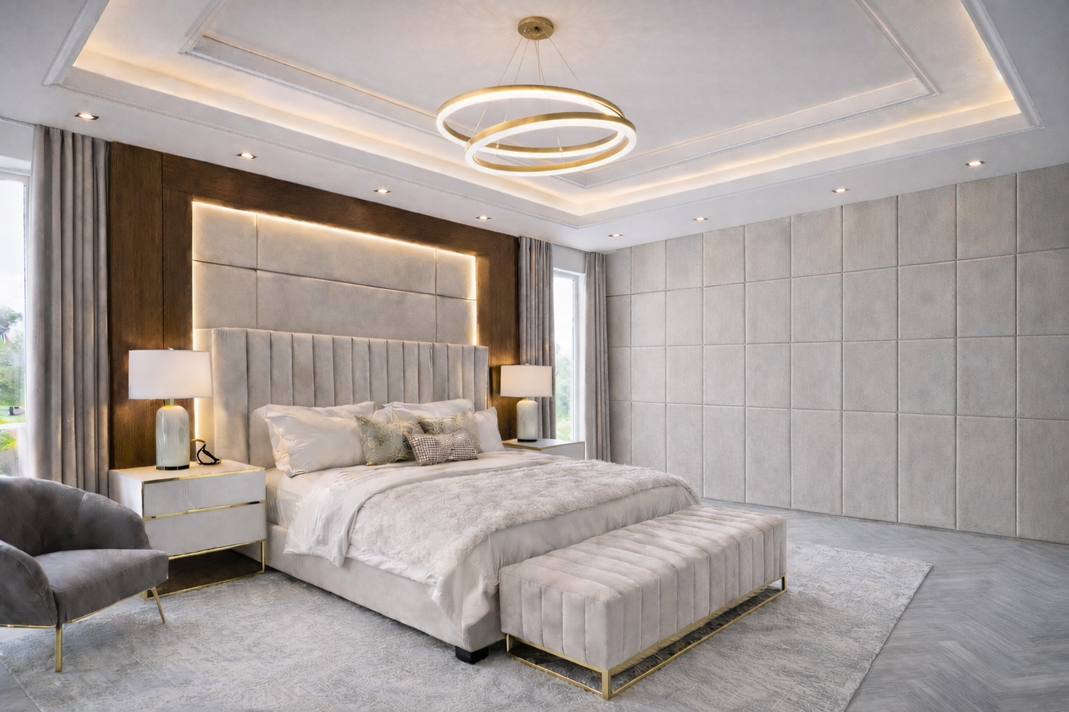 Luxury residential primary bedroom featuring custom upholstered wall panels, layered lighting, and refined modern furnishings designed by ReArt.