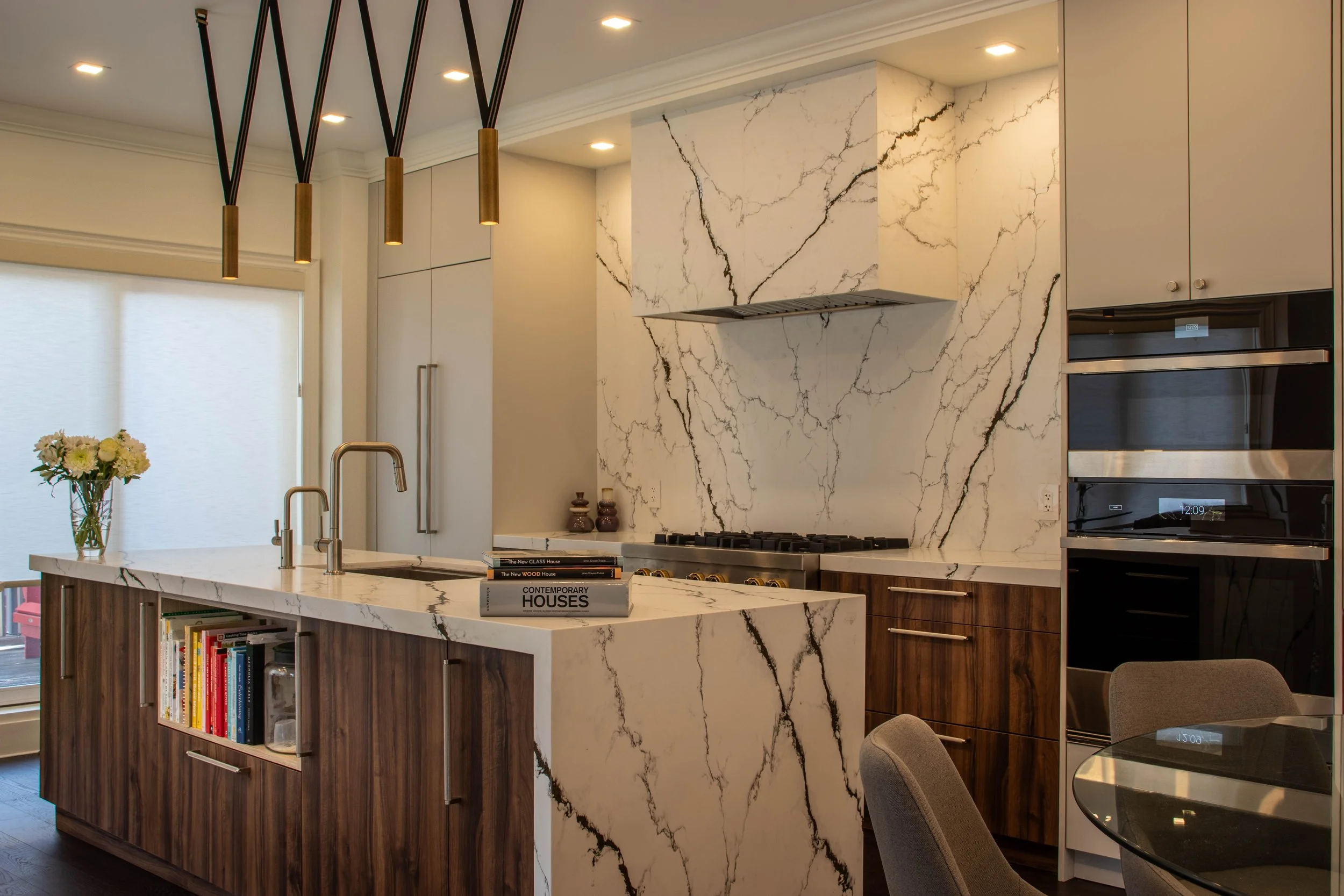 Modern luxury kitchen interior design in Toronto with marble island and custom wood cabinetry