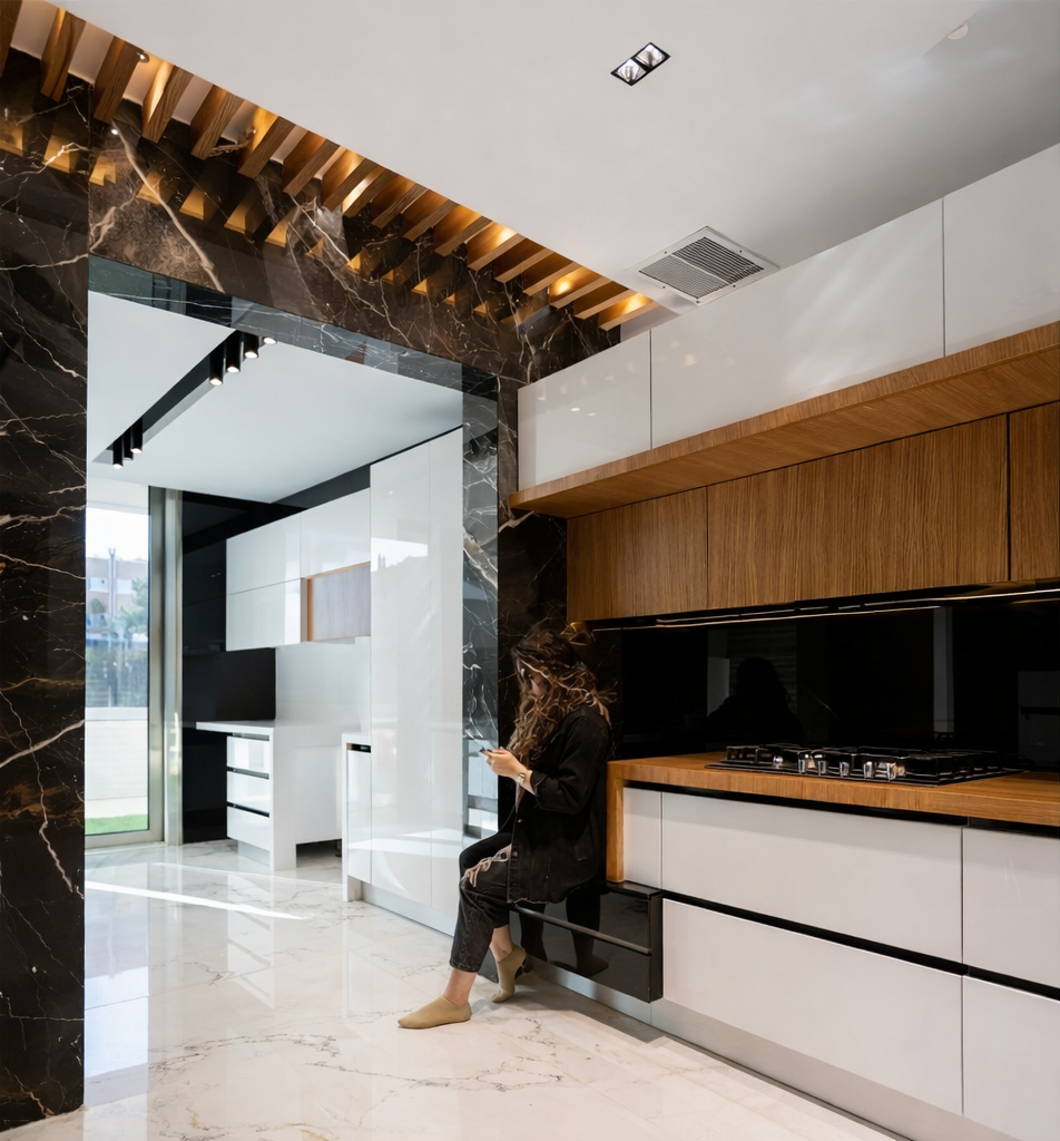 Modern luxury residential kitchen with custom cabinetry, marble finishes, and integrated seating showcasing lifestyle use, designed by reArt.