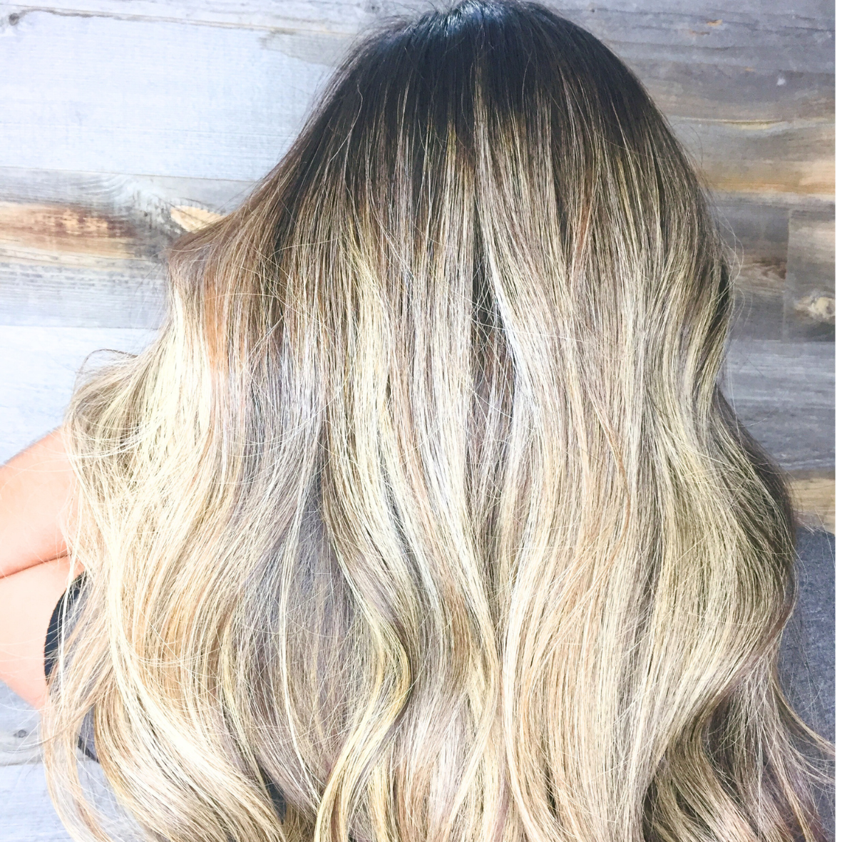 Hair with blonde balayage highlights and loose waves.