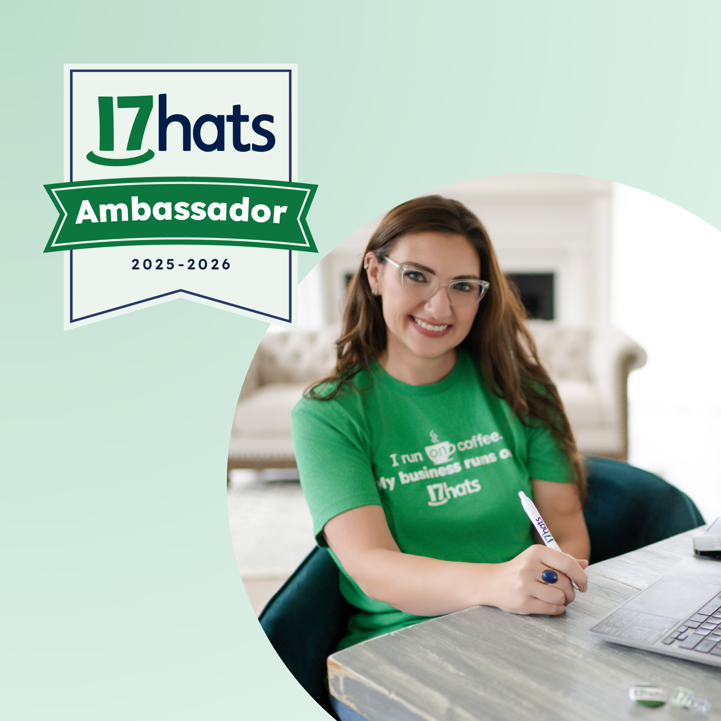 Liz August, 17hats Ambassador 2025-2026 and founder of Simplify, Simplify, at her desk wearing a 17hats t-shirt