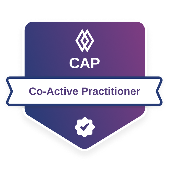 Co-Active Practitioner (CAP) credential badge from the Co-Active Training Institute, featuring a purple gradient shield design with a verification checkmark