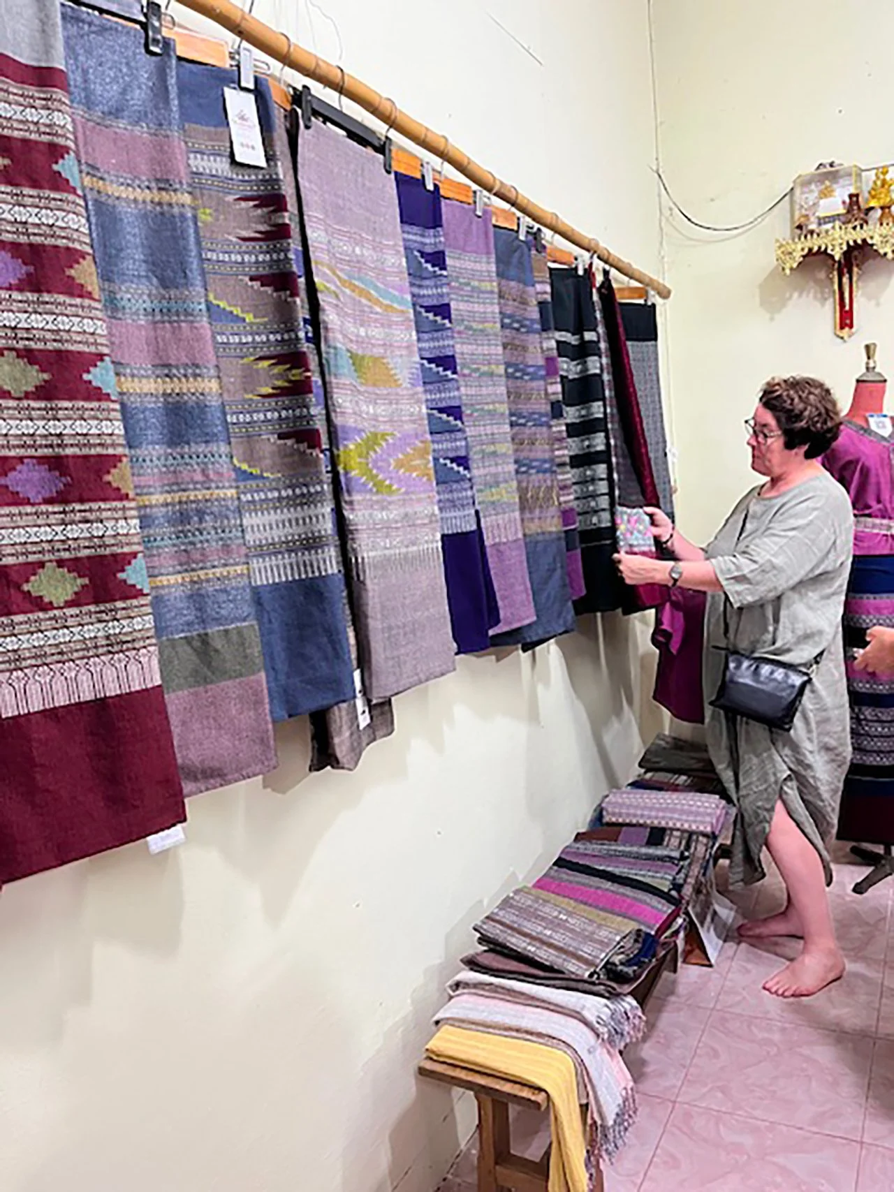 Woman looking at textiles