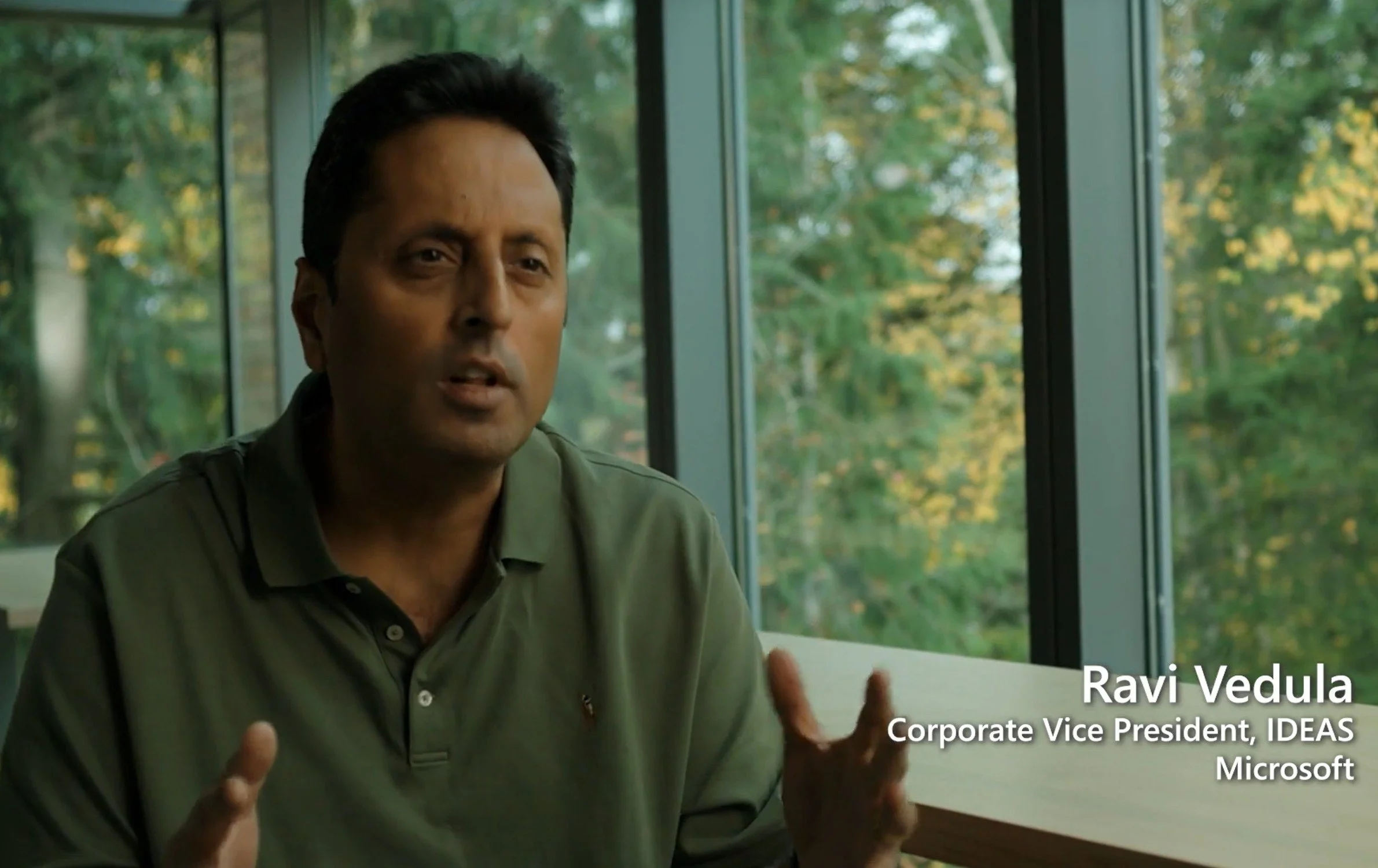 Image of a man in a green polo shirt