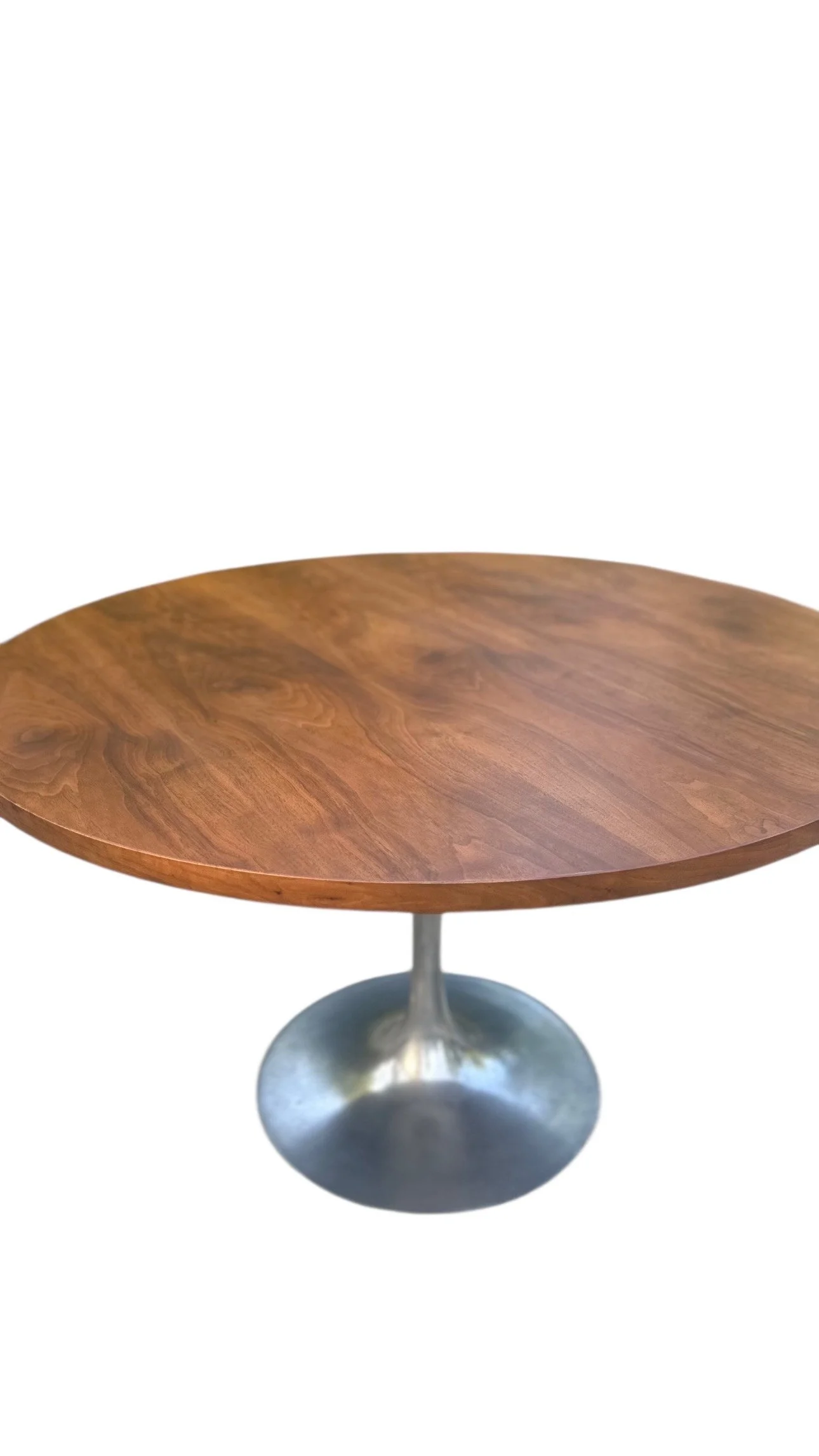 Round wooden table with a metal pedestal base.