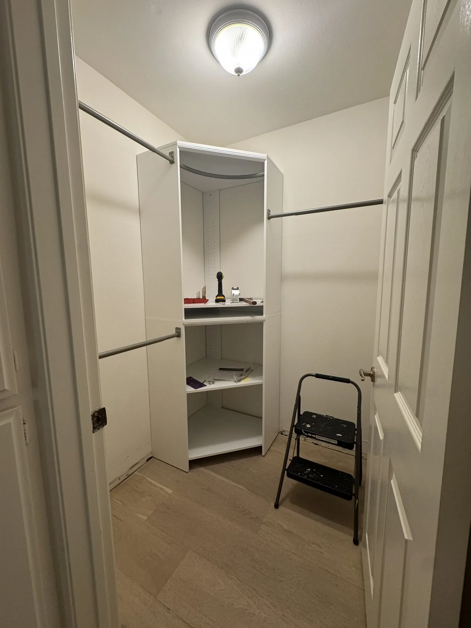 Small Walk-In Closet Update — Hanging rods installed