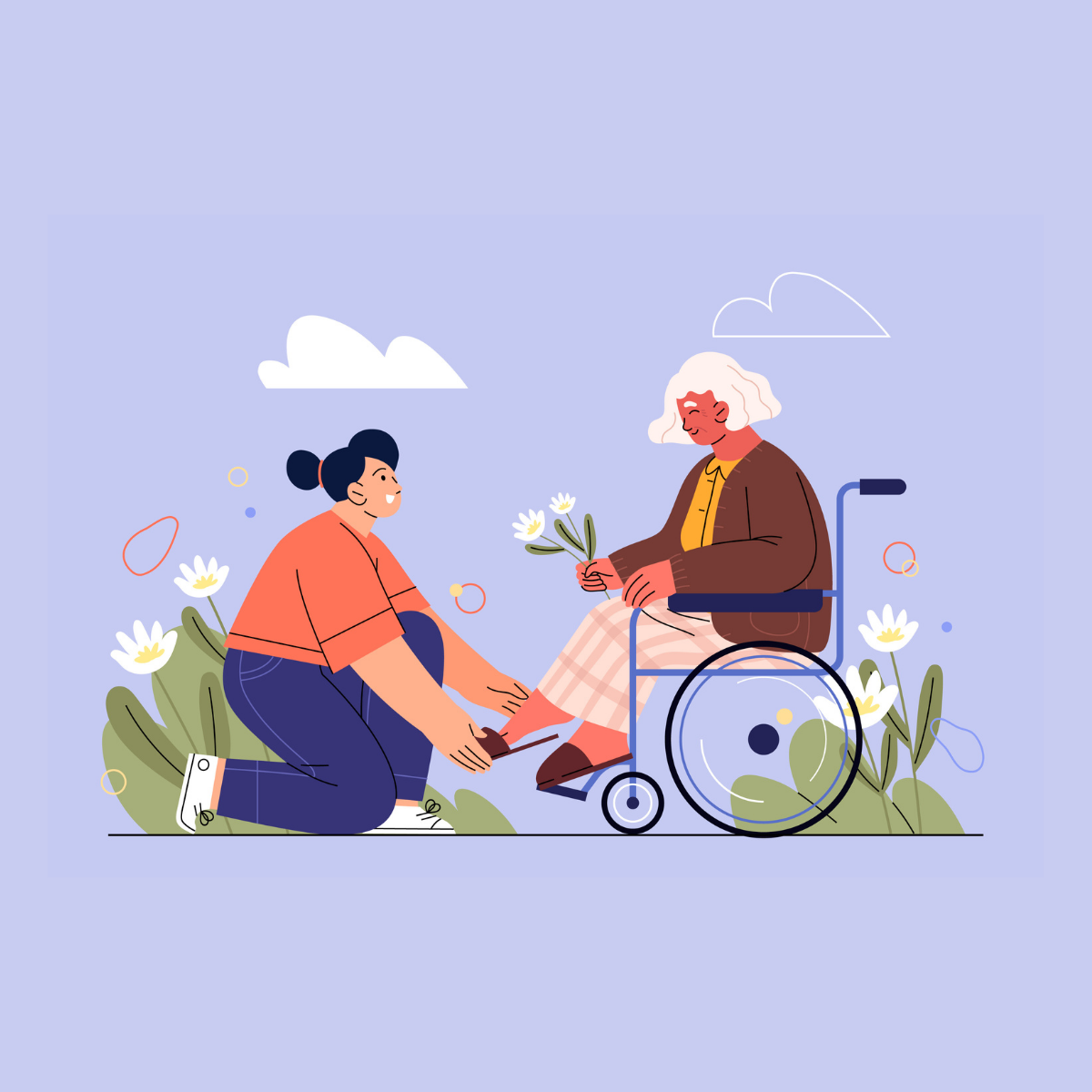 A young woman kneeling and helping an elderly woman in a wheelchair by giving her a flower outdoors with flowers and clouds in the background.