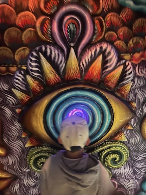 Child looking into swirling eye mural representing the overwhelming thought patterns addressed in anxiety therapy with Rosalie Maduro LMFT in Los Angeles, San Francisco, Park City