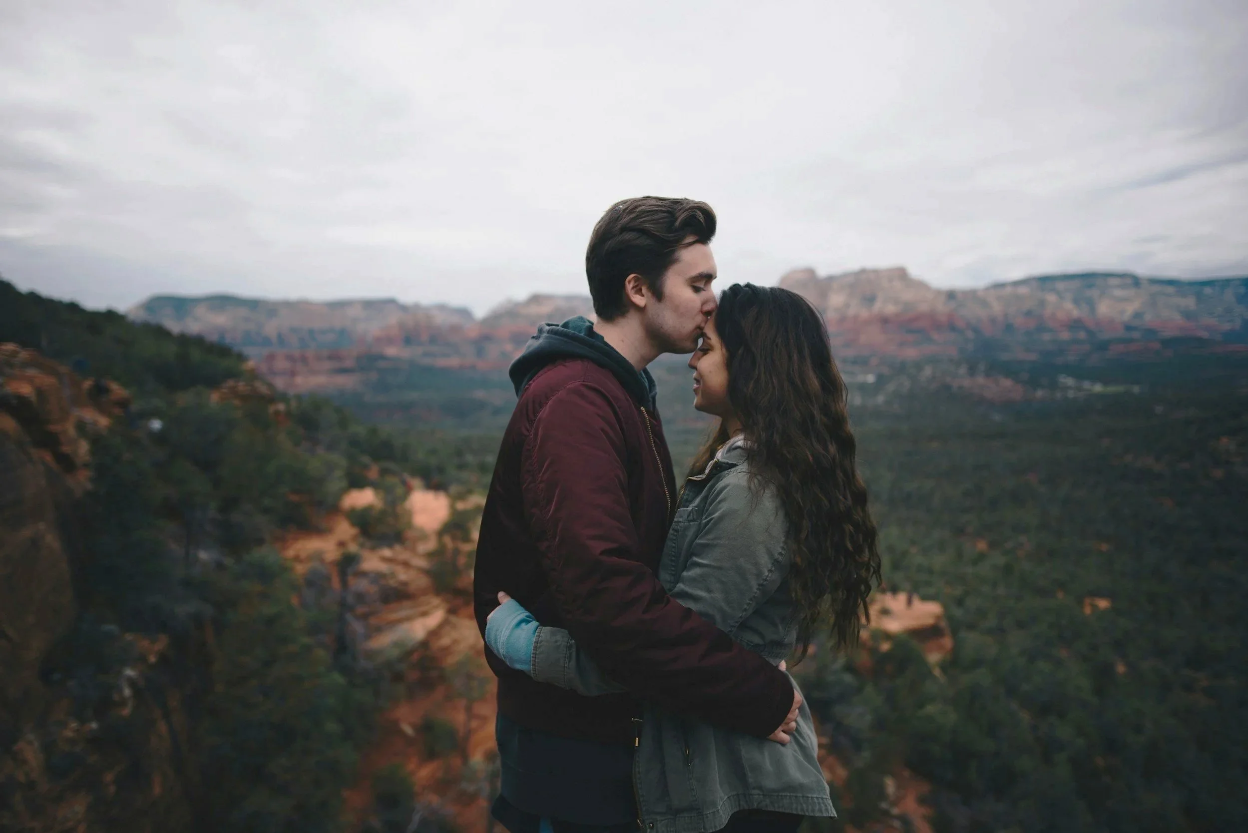 Couple embracing outdoors, representing emotional connection, trust, and relationship growth.