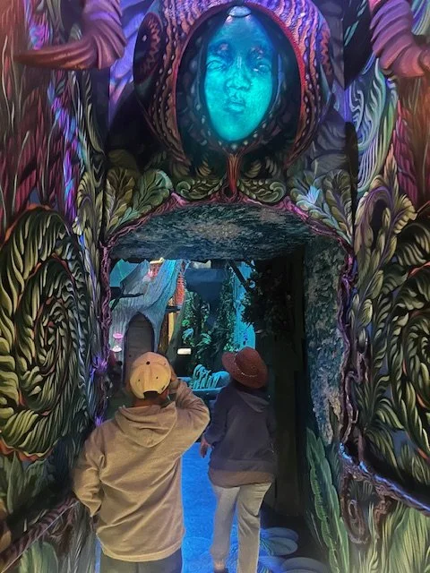 Two figures standing at a threshold doorway representing moving through anxiety toward healing with Rosalie Maduro LMFT in Los Angeles, San Francisco, and Park Cioty