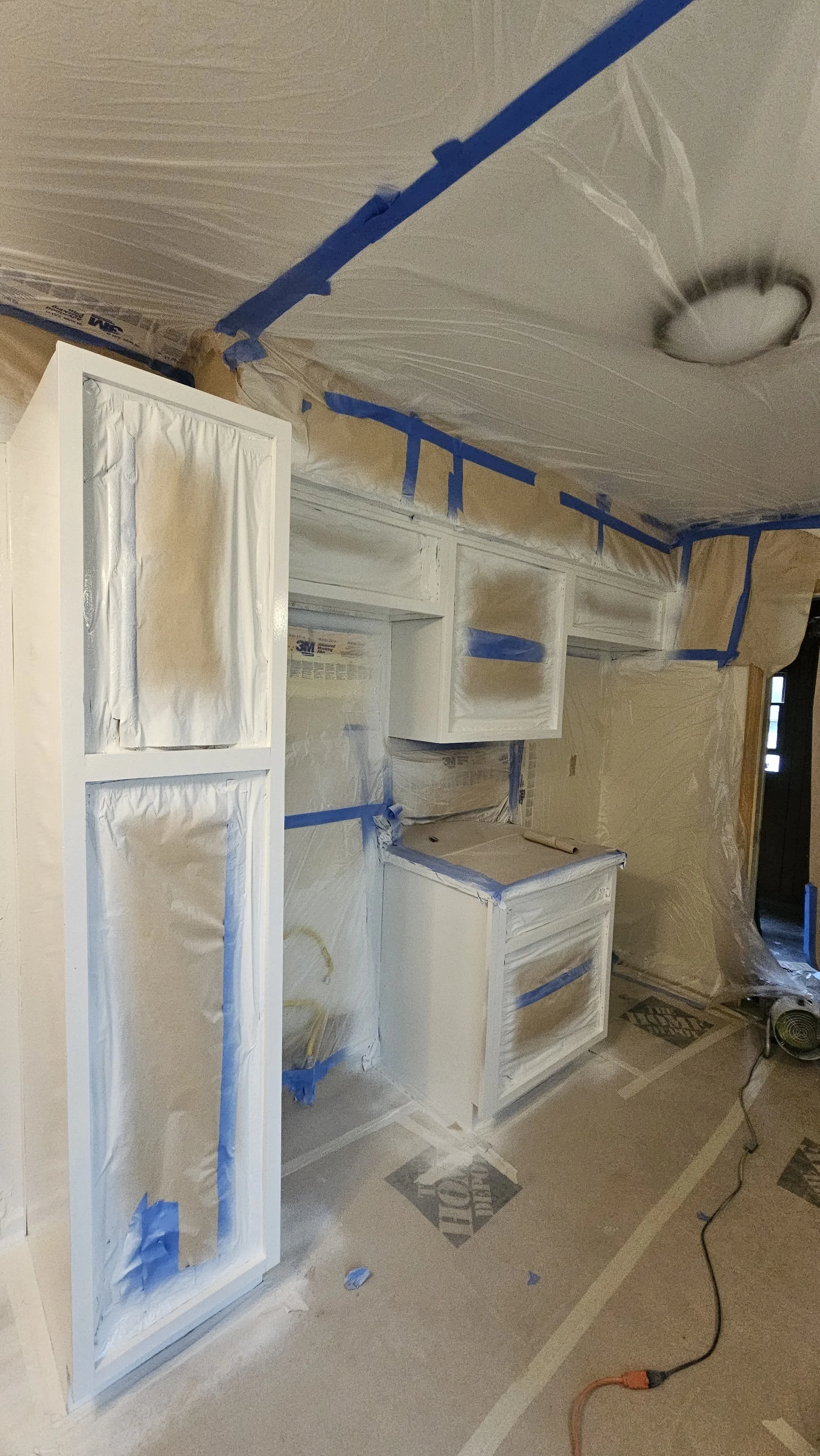 Professional kitchen cabinet painting preparation and masking process