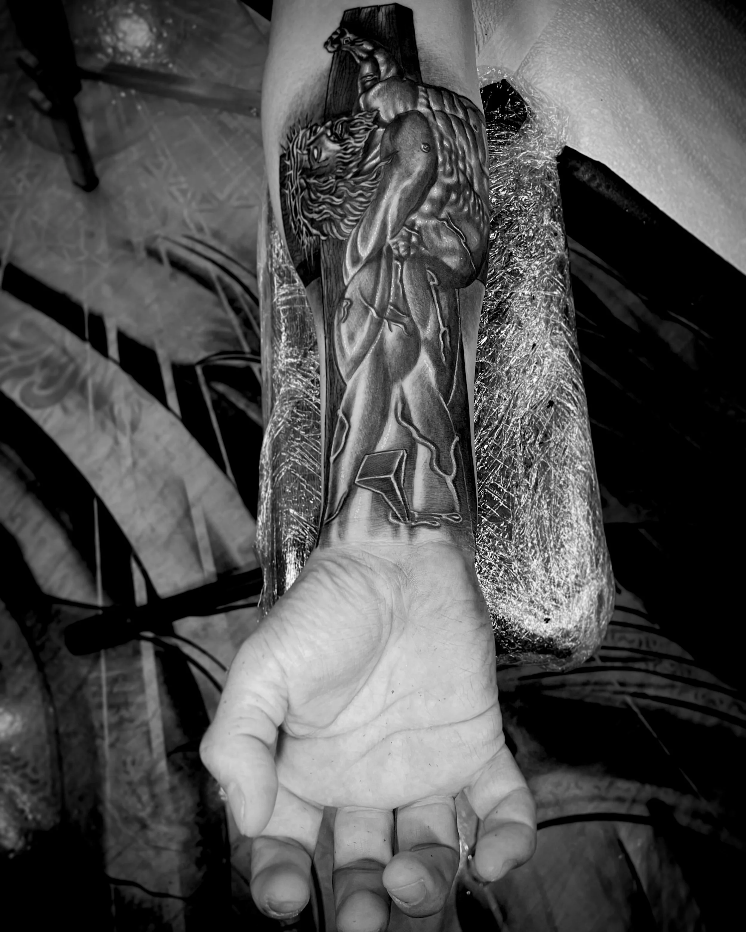 Black and white religious tattoos