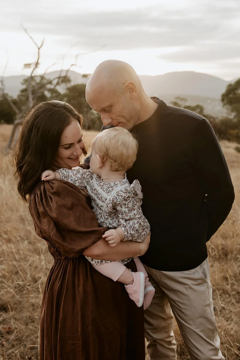 Photo of Hobart Photographer Meegan Wilmot and her family in a field