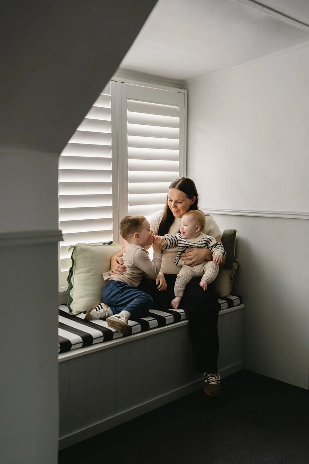 Mum with her two sons cuddling at in home Motherhood photoshoot in Hobart