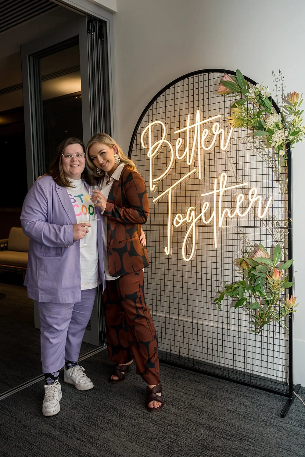 Couple at their engagement party being photographed by Hobart event photographer