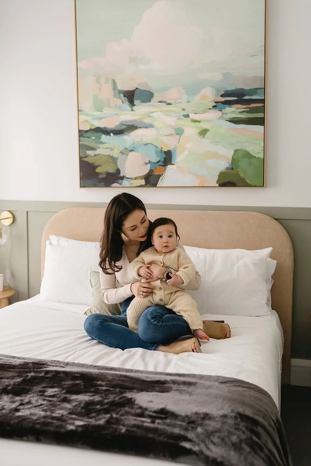 Mum and baby on bed having Christmas family photos in Hobart