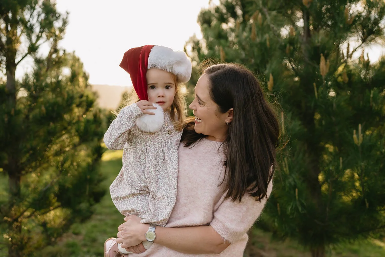 Outdoor family Christmas photography amongst the trees at Coal Valley Christmas Tree Farm near Hobart